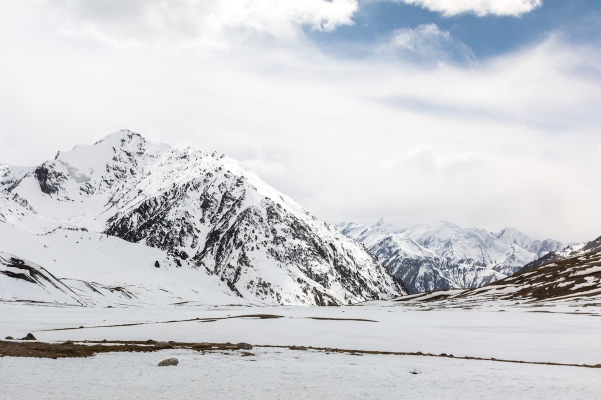 Trekkers crossing a high mountain pass in the Karakoram Range