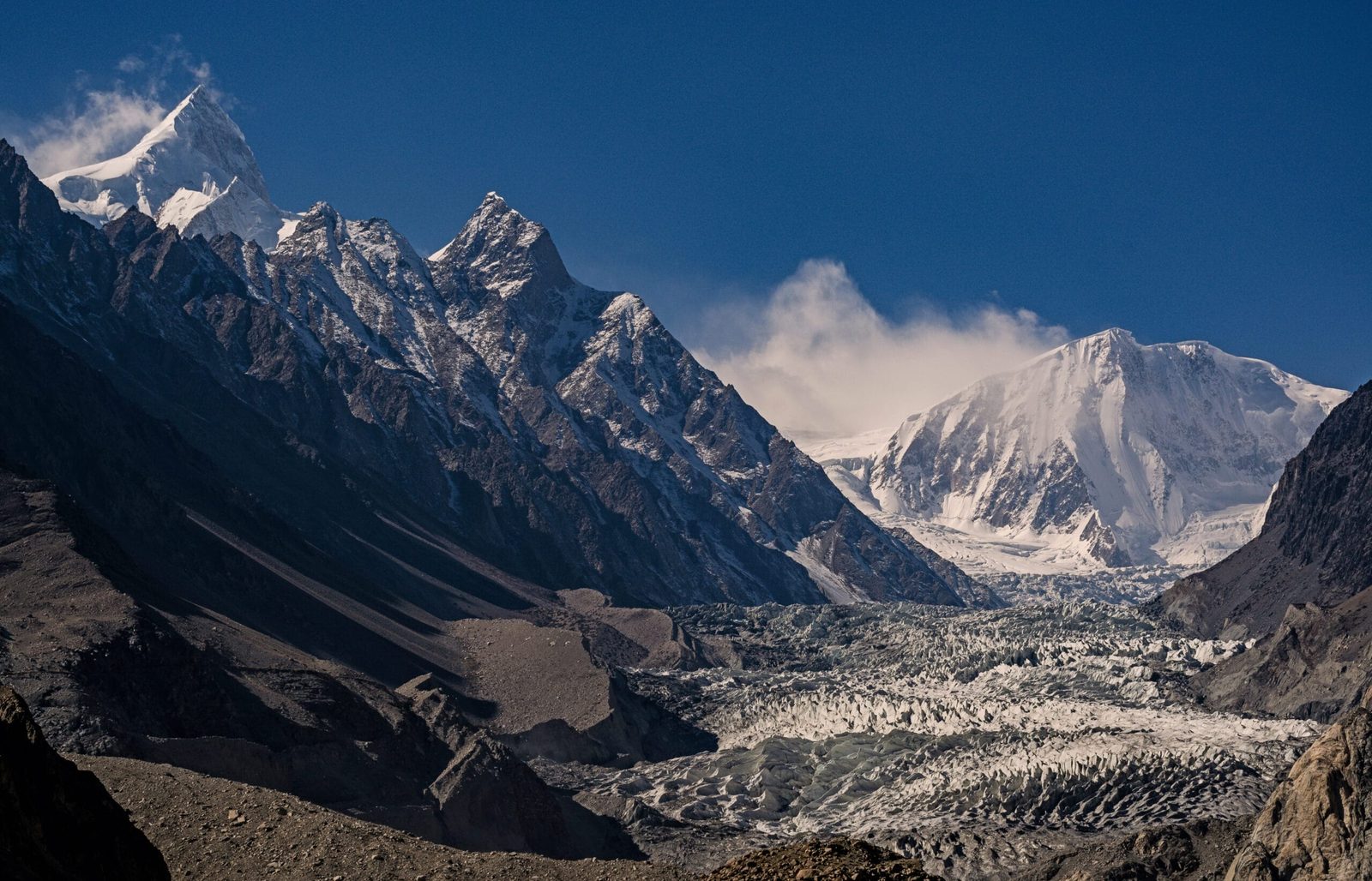 Passu Peak rising above the crevassed Passu Glacier