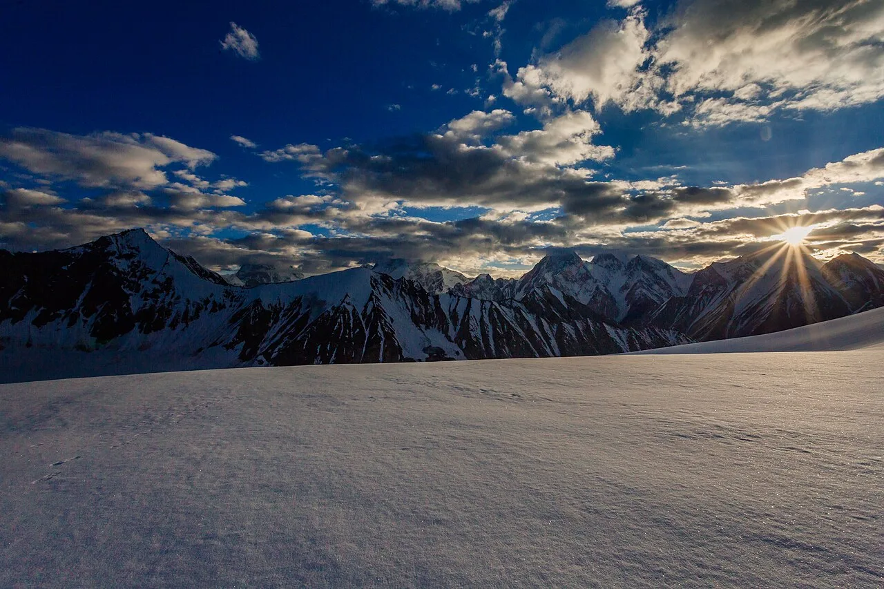 Sunrise over K2, Broad Peak and Gasherbrum II seen from the top of Gondogoro La pass at 5,585 m
