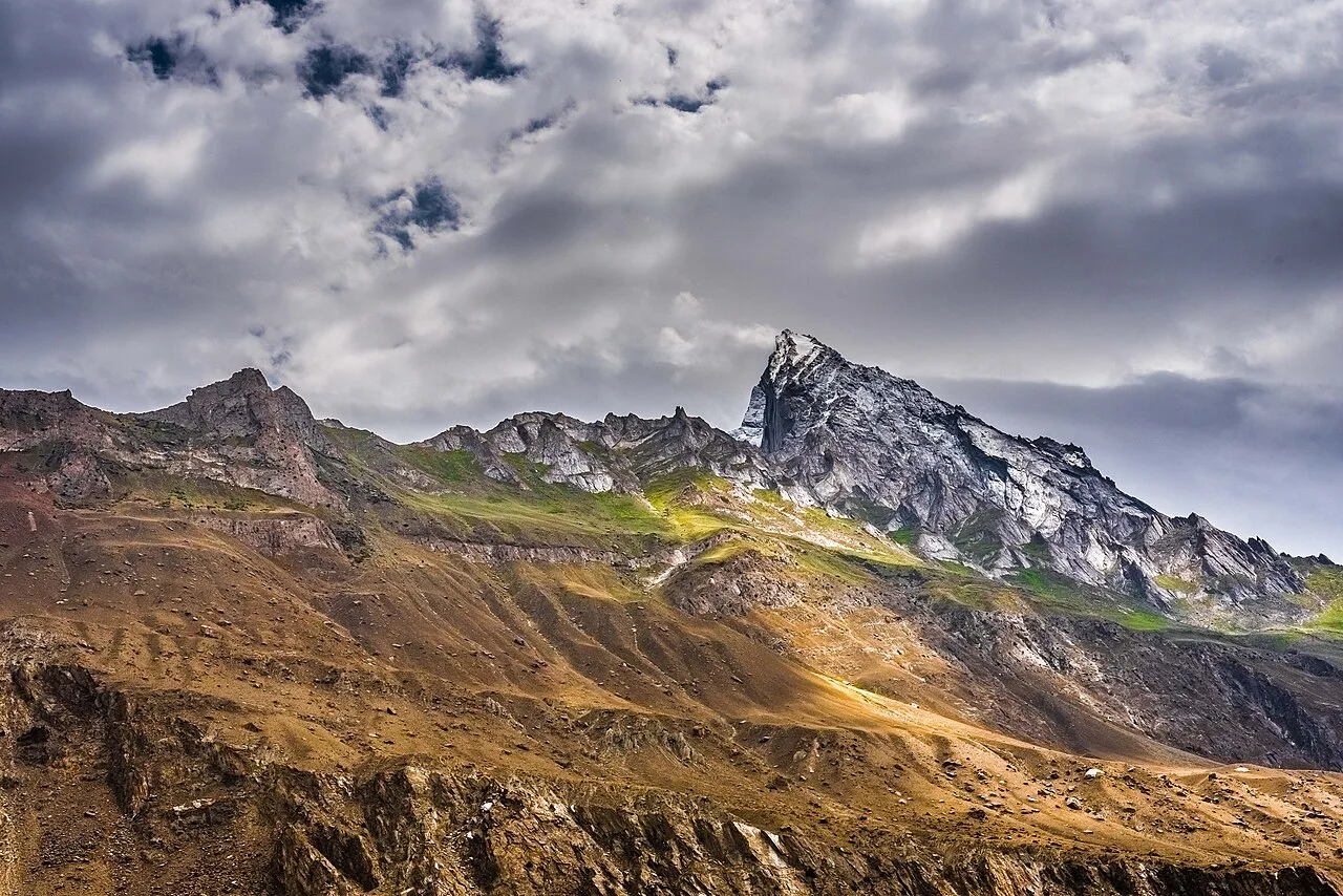 Granite peaks and green summer pasture in the Hushe Valley, the trailhead for Laila Peak and the K6 and K7 base camps