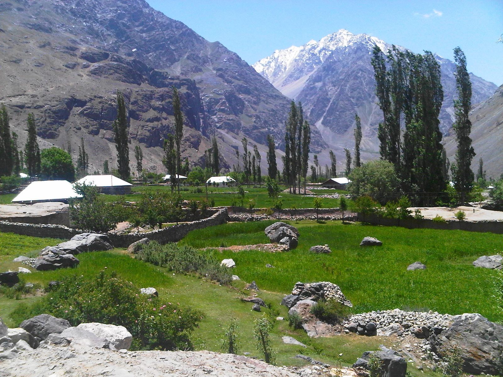 Wide grassy plateau of Shandur Pass between Chitral and Gilgit-Baltistan