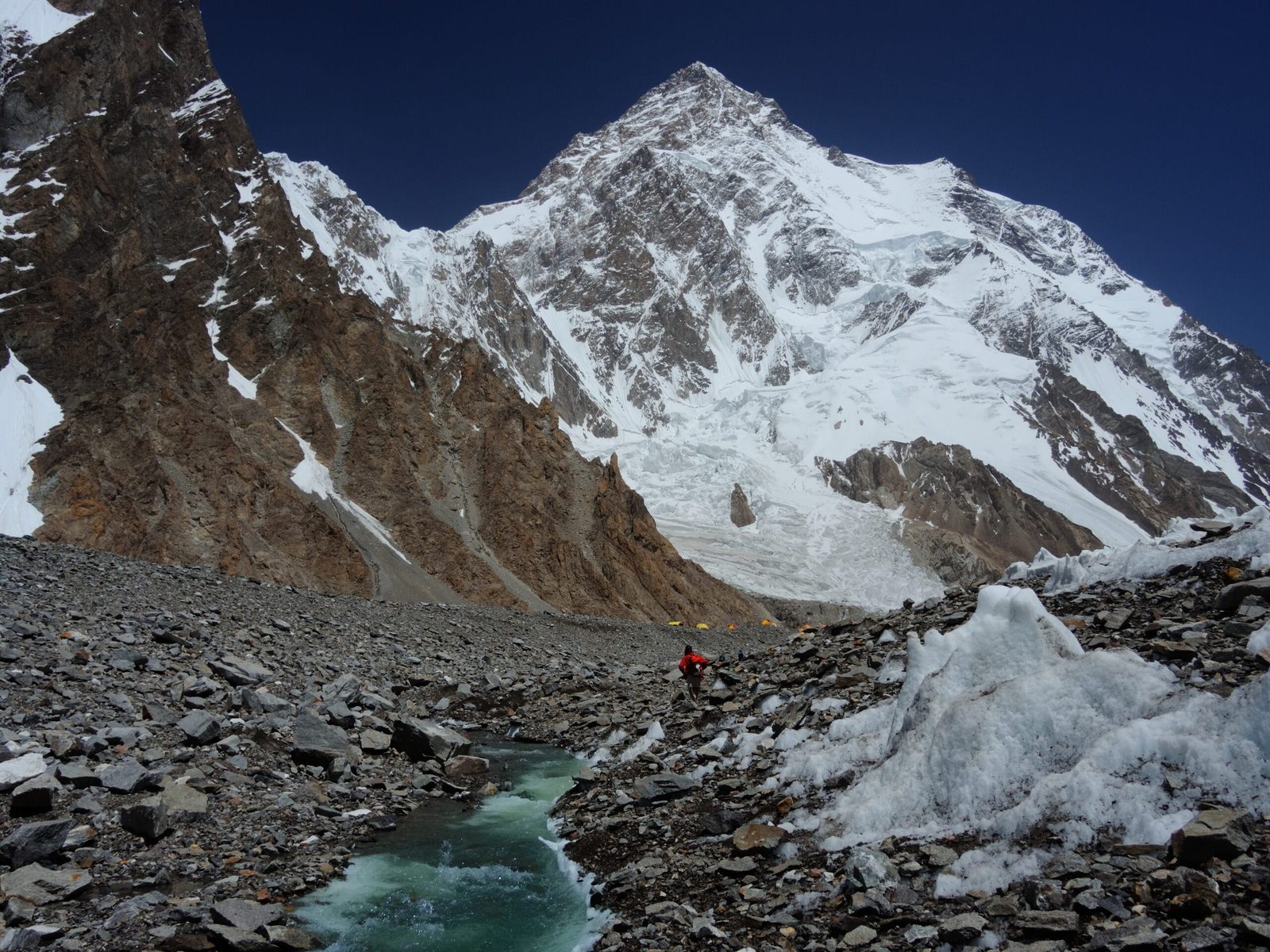 Trekkers on the Godwin-Austen Glacier approaching K2 Base Camp in the Karakoram