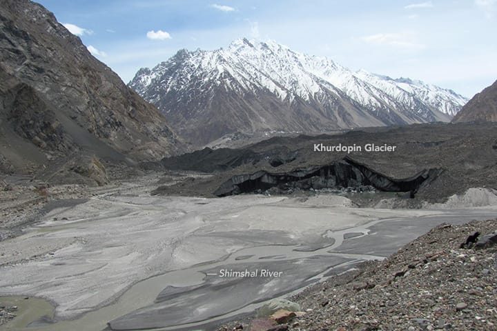 Debris-covered snout of the surging Khurdopin Glacier damming the Shimshal River in 2017
