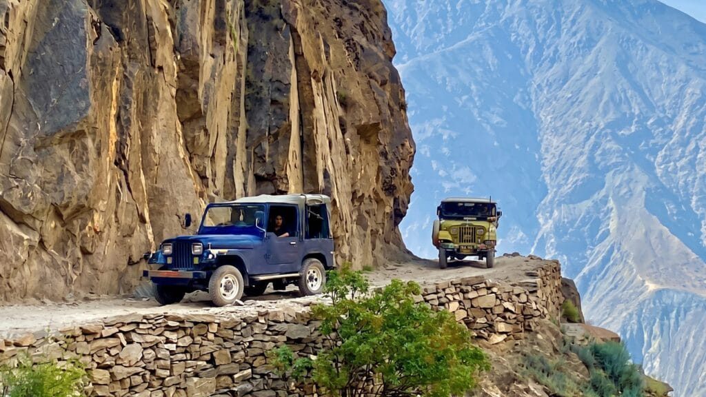 Jeeps on the Raikot cliff track, stage two of the Islamabad to Fairy Meadows route.